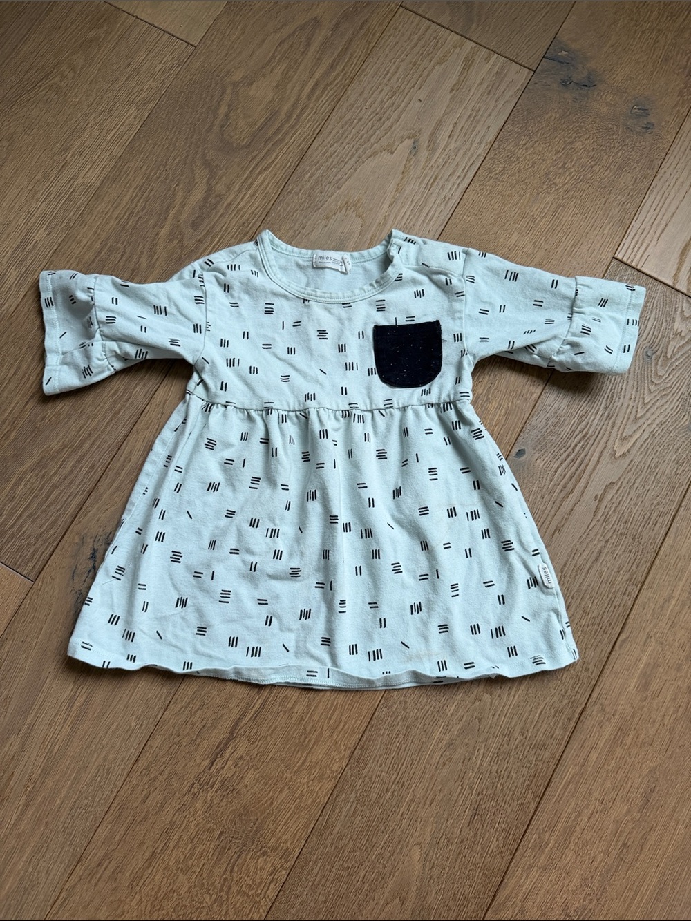 Light Mint Baby Dress with Black Pocket Accent
